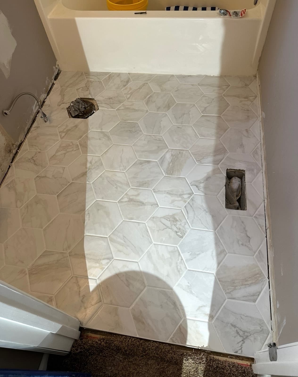 Hexagon tile shower floor and bathroom tile installed in Spokane