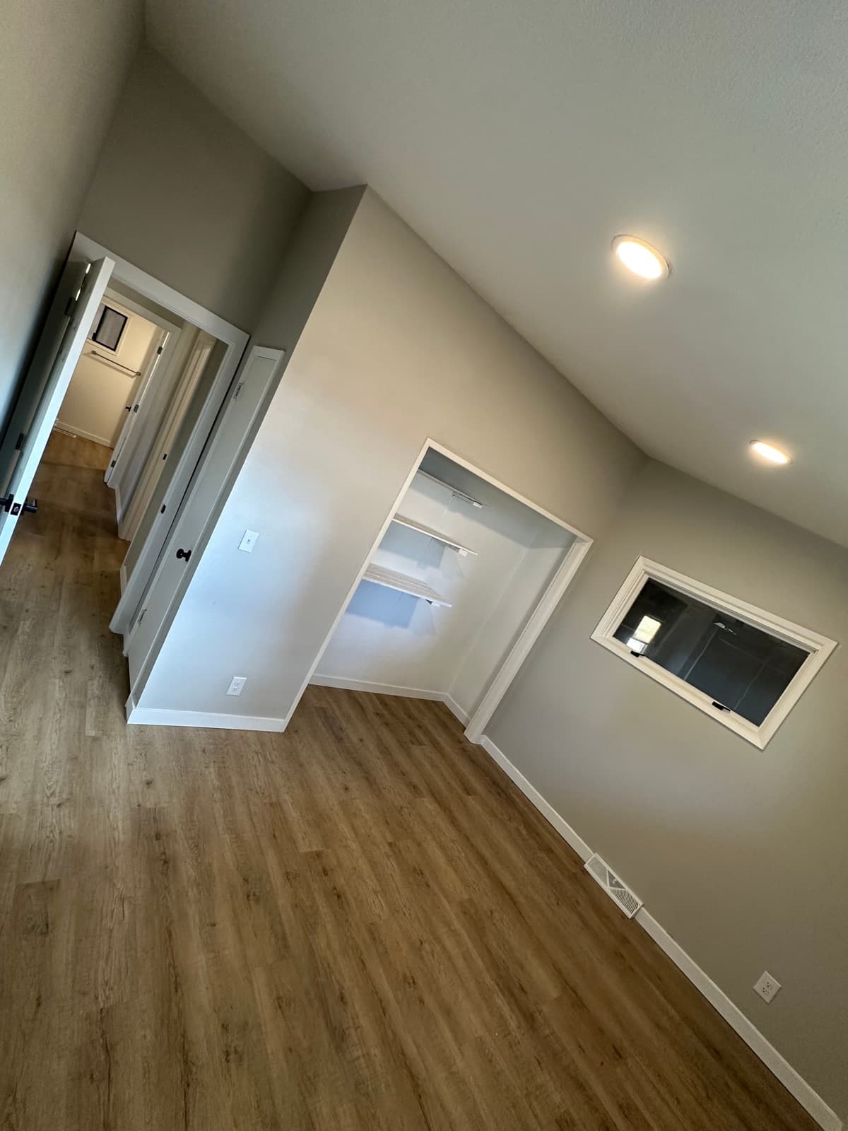 Newly remodeled room with warm oak luxury vinyl plank flooring